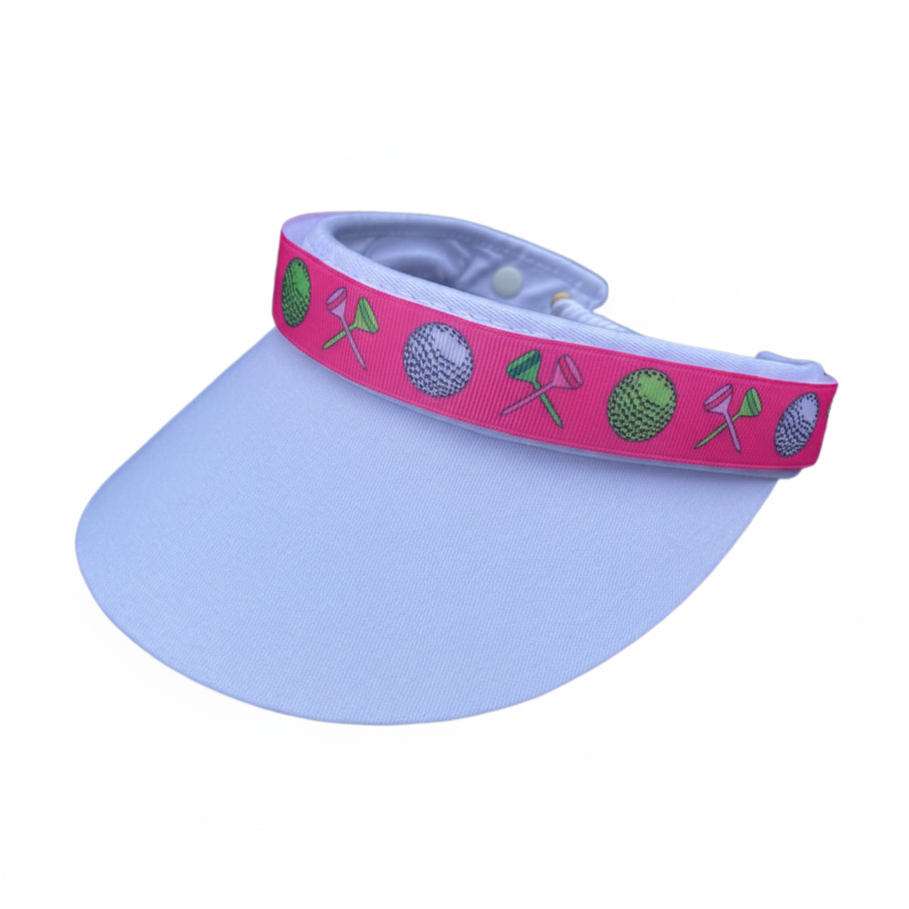 Light blue visor with pink golf band clean background