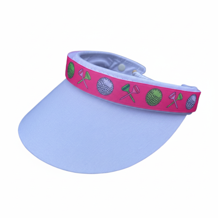 Light blue visor with pink golf band clean background