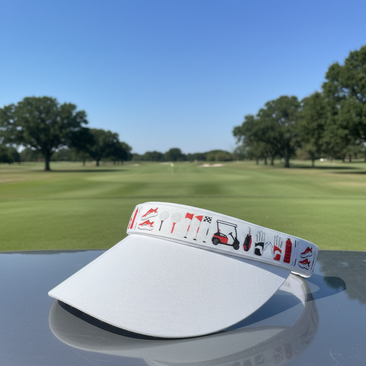 White visor with golf-themed band on golf course background